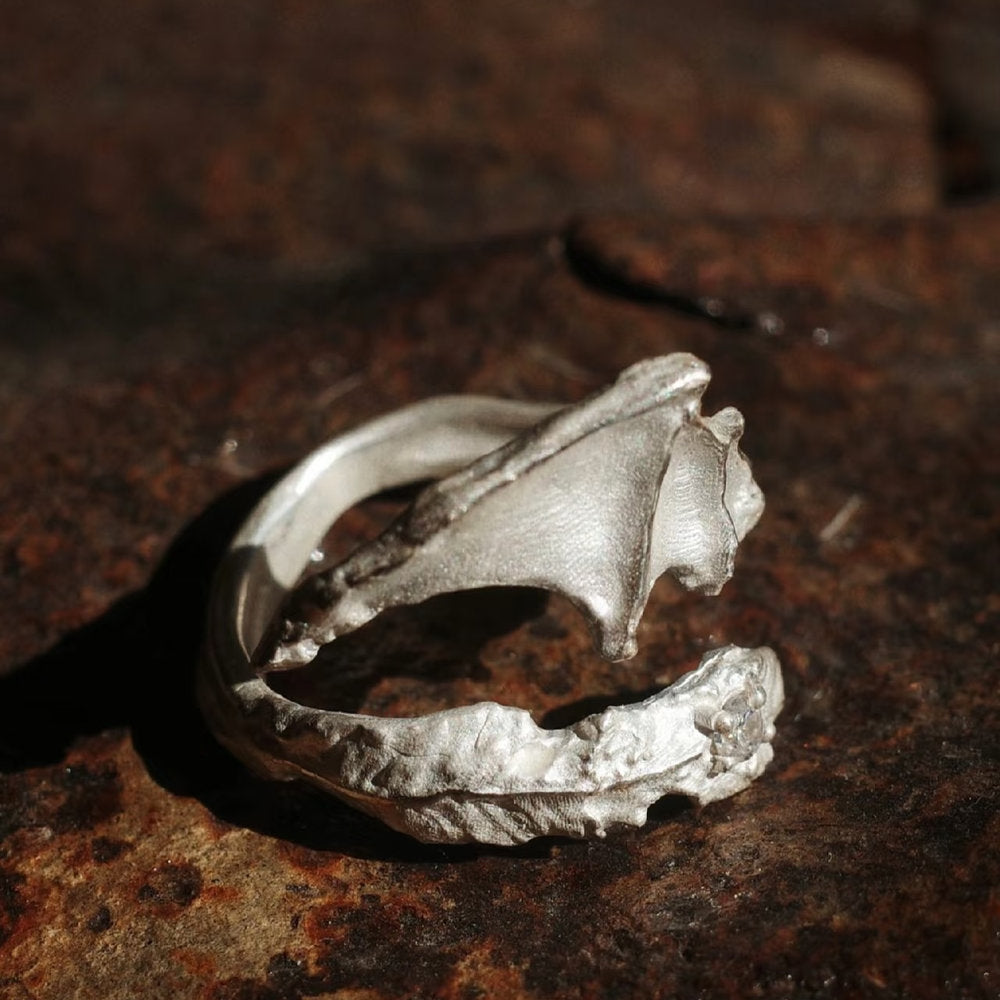 Silver dragon wing ring with a unique design