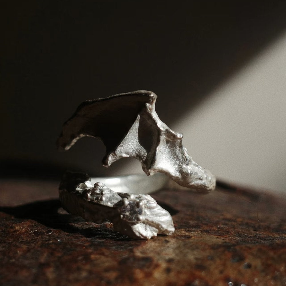Close-up of a silver Draconic Wings ring
