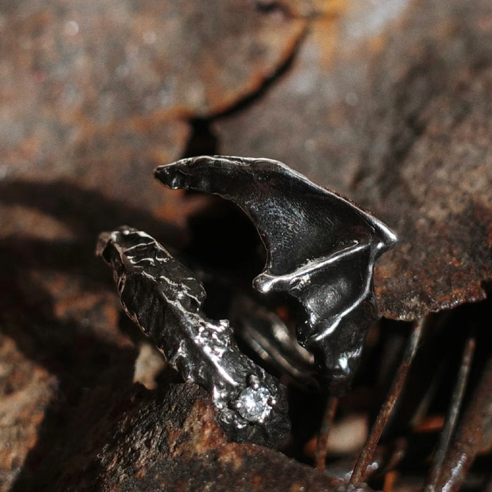 Close-up of a shadow handmade dragon wing ring