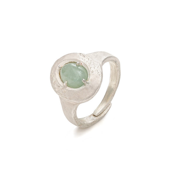 an aventurine ring on a white background