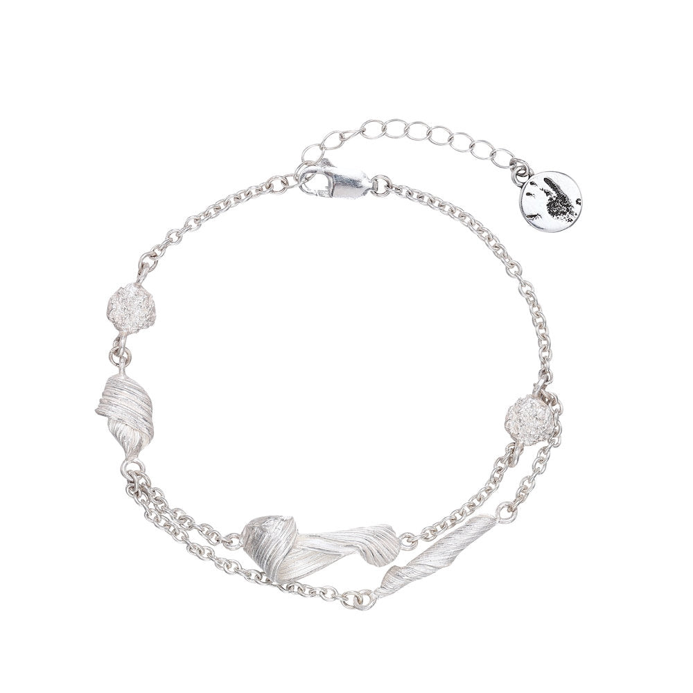 matte Silver bracelet with twist designs on a white background