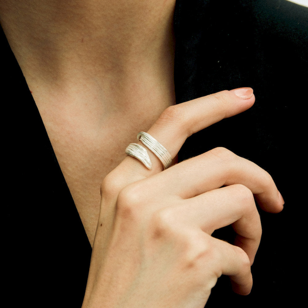 Close-up of a hand wearing Linear Double Rings