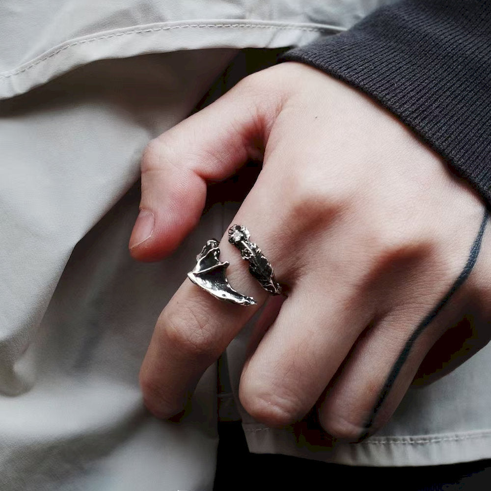 Close-up of a hand wearing one Oxidized silver ring