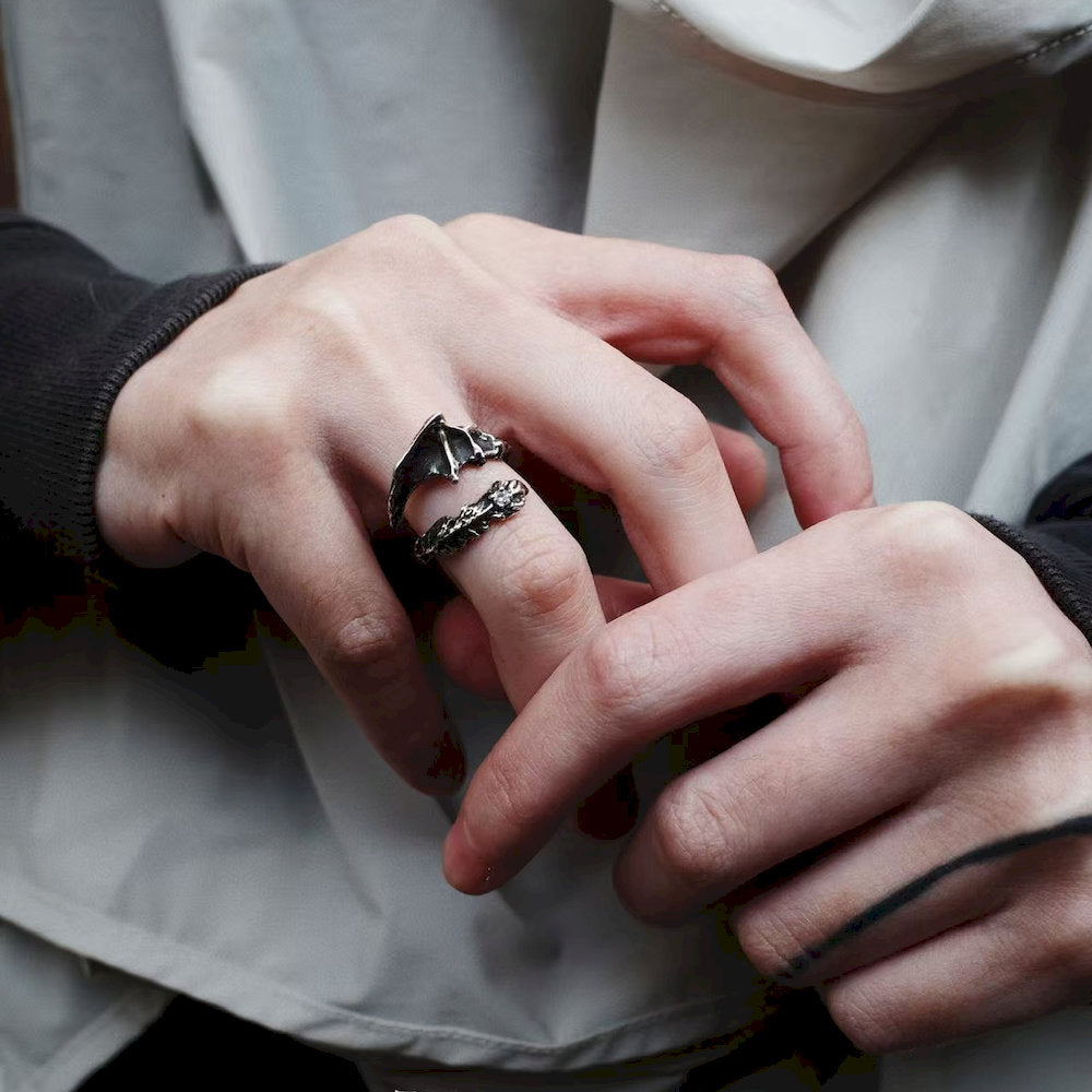 Close-up of hands with a detailed ring