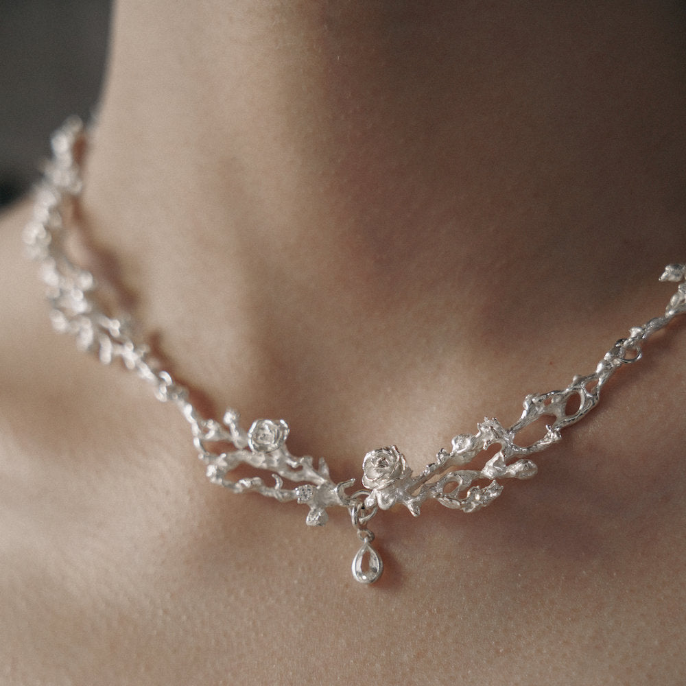 Silver necklace with floral design and teardrop pendant for a Medieval style
