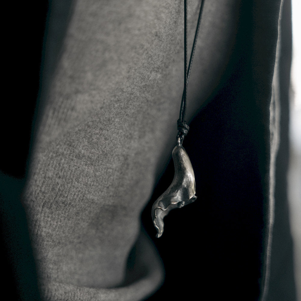 handmade Silver flower pendant on a black cord