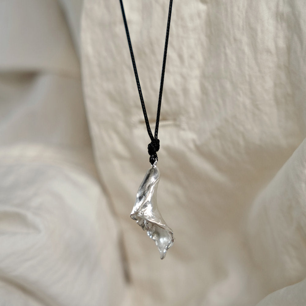 Silver handmade calla pendant necklace on a dark cord