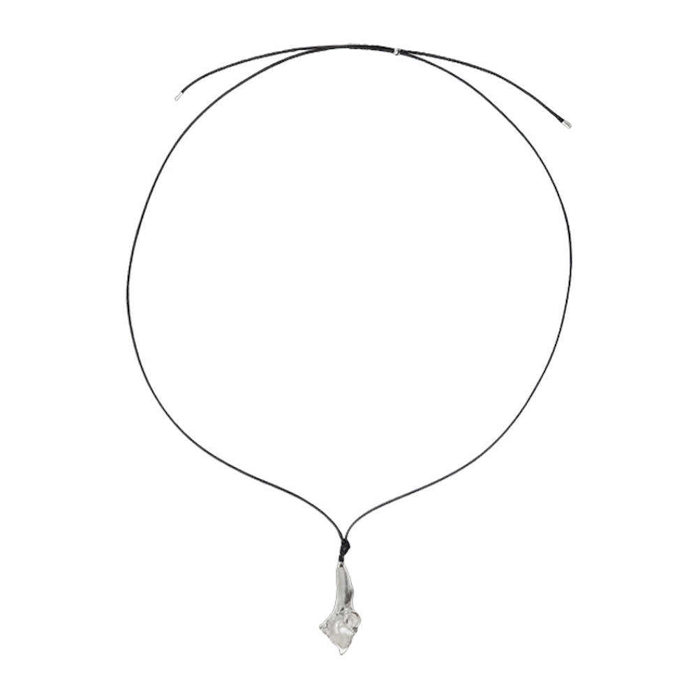 Black cord necklace with a shiny silver flower pendant on a white background
